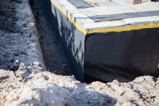 Professional Foundation Crack Repair technician working in Aston, PA